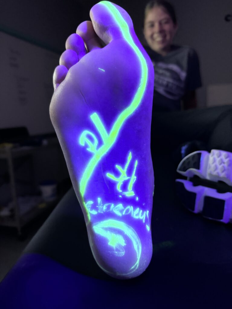 foot anatomy marked with blacklight ink