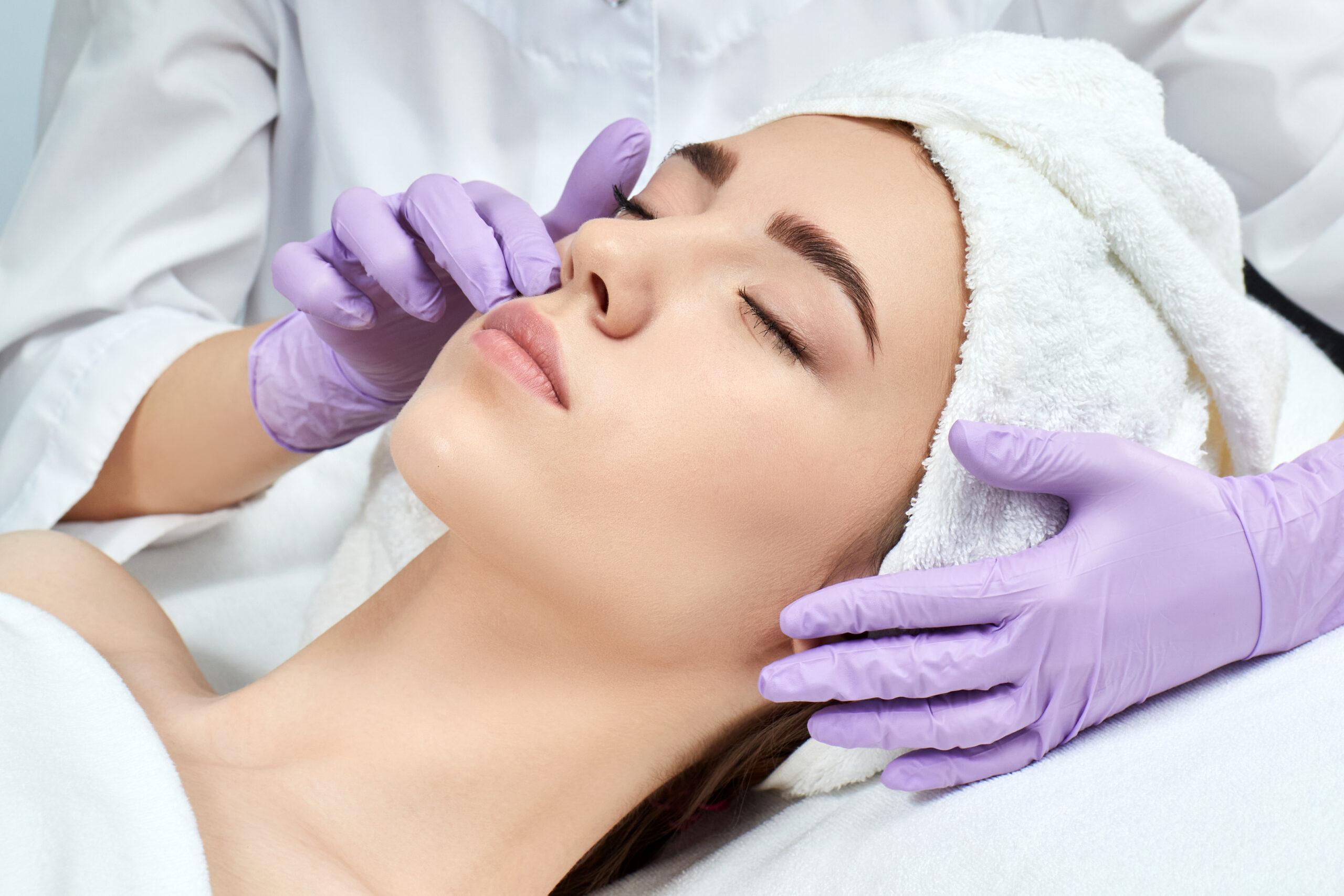 spa patient receiving facial treatment