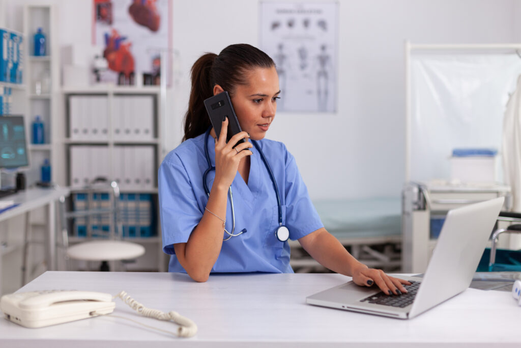 girl answering phone at medical desk