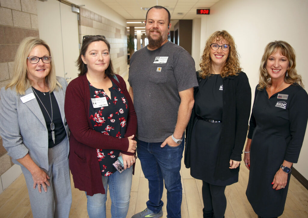 Cabinet refinisers Jeremy & Kimberly Gilleland smile with CV Tech staff and representatives of the Small Business Development Center.